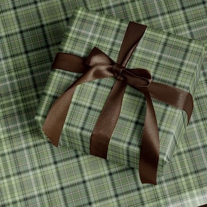 Christmas plaid wrapping paper roll with classic green and red tartan design