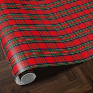 Christmas wrapping paper with plaid and tartan patterns in royal steward red for a timeless look.