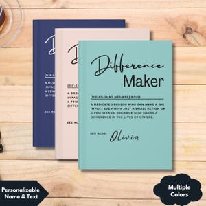 May include: Three notebooks in navy blue, blush pink, and teal. The teal notebook has the words "Difference Maker" and the name "Olivia" printed on the cover. The other notebooks have the words "A dedicated person who can make a big impact" printed on the cover.