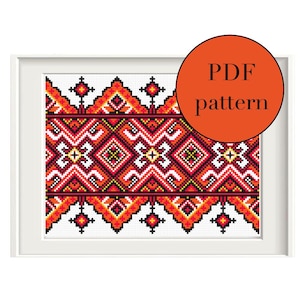 May include: A digital PDF pattern for cross stitch embroidery featuring a colorful geometric design with red, orange, yellow, black, and white colors. The pattern is framed in a white frame and the text "PDF pattern" is written in black on an orange circle.
