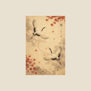 May include: A rectangular art print featuring two white cranes with black markings flying against a beige background. A thin red string connects the cranes. Red maple leaves are visible in the corners, and Japanese text is printed on the right side.