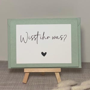 Wisst ihr was? Schwangerschaft verkünden – Überraschungskarte für die Familie