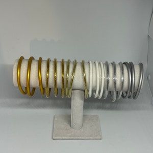 gold and silver colored bangle and Buddhist bangle image 6