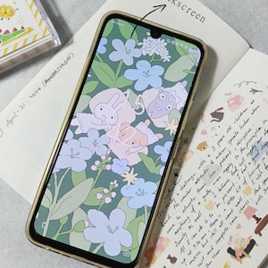 May include: A gold smartphone with a floral and cartoon character wallpaper. The screen displays the time and a star icon. The text "Lockscreen" is written above the phone.
