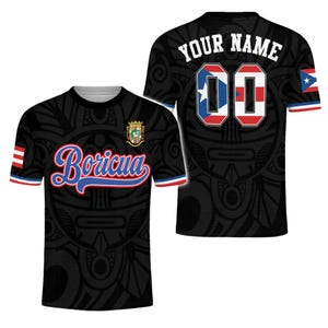 May include: Black t-shirt with a Puerto Rican flag design. The front features the word "Borícua" in blue script, and the back has space for a name and number. The shirt has red, white, and blue accents.