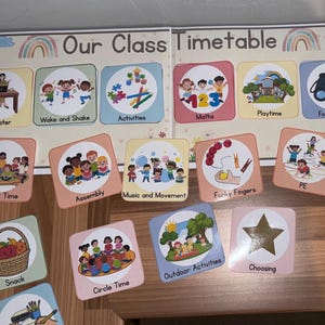 May include: A classroom timetable labelled "Our Class Timetable" with illustrated cards. The cards show activities such as "Wake and Shake," "Activities," "Maths," and "Playtime." The design includes a rainbow and various activity illustrations.