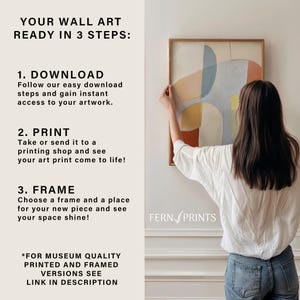 May include: An abstract art print in a wooden frame, featuring a design in beige, blue, orange, and yellow. A person is shown hanging the artwork. Text on the left side reads "YOUR WALL ART READY IN 3 STEPS:" with instructions for downloading, printing, and framing.