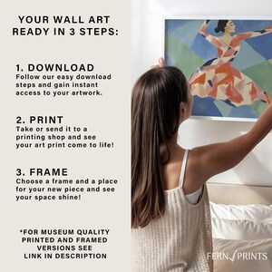 May include: A woman is hanging a framed print of a dancer on a wall. The print is colorful and abstract. The text on the wall reads "Your Wall Art Ready in 3 Steps: 1. Download 2. Print 3. Frame *For Museum Quality Printed and Framed Versions See Link in Description Fern Prints"