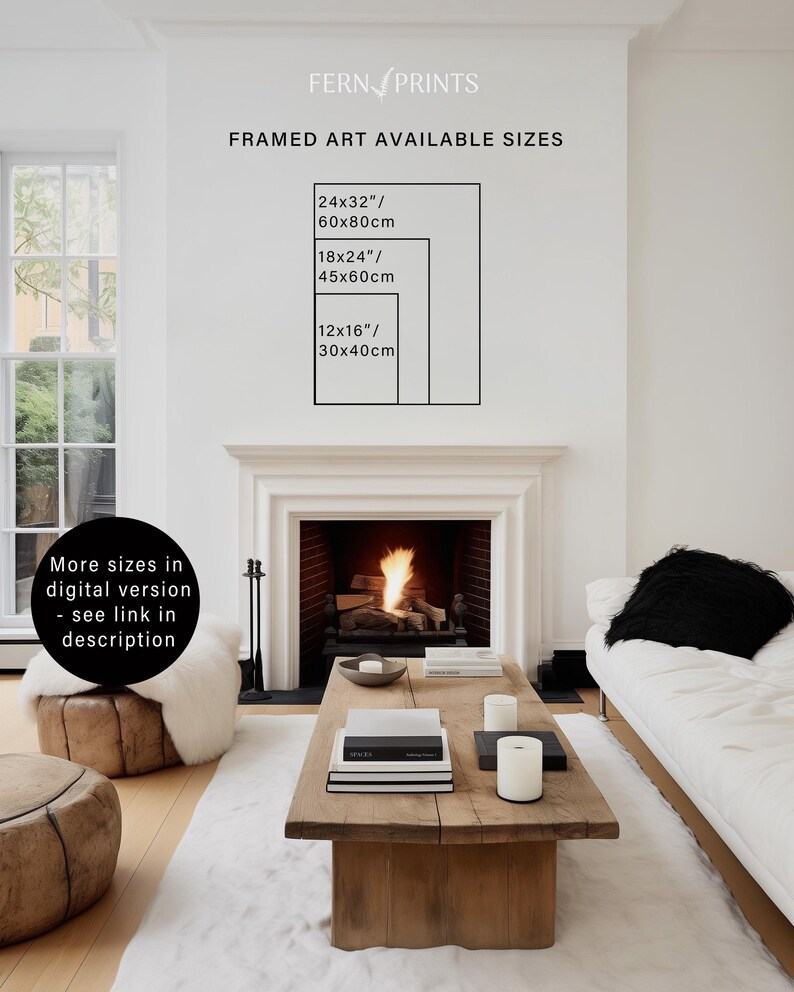 May include: A framed art print with a white background and black text listing different sizes available in inches and centimeters. The text reads "FRAMED ART AVAILABLE SIZES" and lists the following sizes: 24x32"/60x80cm, 18x24"/45x60cm, 12x16"/30x40cm. The print is displayed on a white wall above a fireplace with a roaring fire.