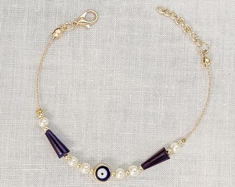 Handcrafted Evil Eye Bracelet: Pearls and Purple Beads