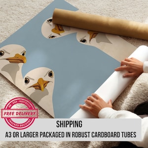 May include: A light blue poster featuring a cartoon illustration of seagulls with yellow beaks and black eyes. The poster is packaged in a brown cardboard tube. The text "FREE DELIVERY" is visible.