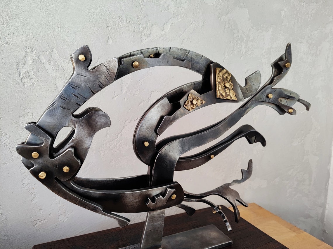 Steel Fish nautilus. Abstract Sculpture is a Decoration That Will Bring ...