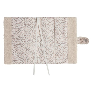May include: A white book cover with a pink polka dot pattern and a soft, fluffy white border. The cover has two white ribbon ties.