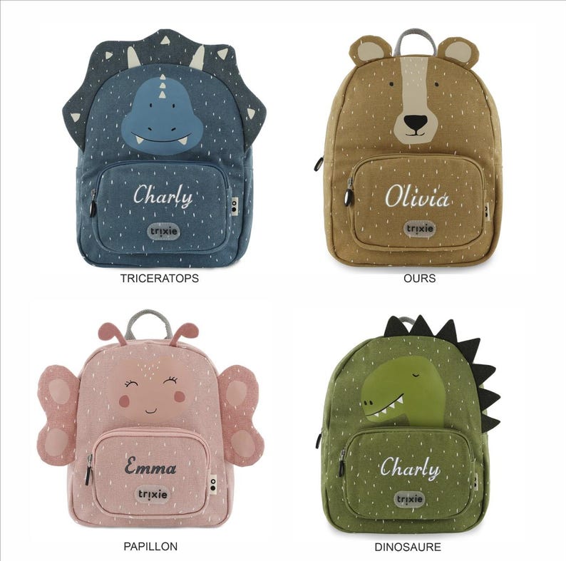 May include: Four children's backpacks in various animal designs. The backpacks include a blue triceratops, a brown bear, a pink butterfly, and a green dinosaur. Each backpack has a name printed on it and the brand name "trixie".
