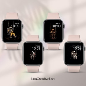 May include: Three Apple Watch faces with a black background and a white astronaut sitting on a swing in space. The time is 10:09 and the day is Friday the 23rd.