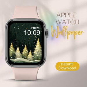 May include: A pink Apple Watch with a dark green and gold winter forest scene as the wallpaper. The time is 10:09 and the date is FRI 23. The text "APPLE WATCH Wallpaper" is in gold lettering and the text "Instant Download" is in a yellow rectangle.
