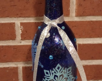 Christmas/winter decorative lit wine bottle