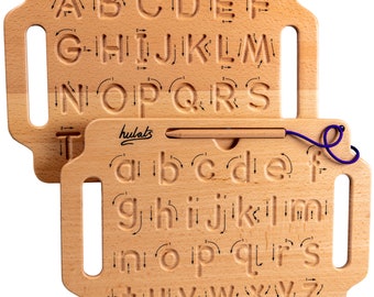 May include: Two wooden alphabet tracing boards with uppercase and lowercase letters. The boards have grooves for tracing the letters with a pencil. The boards are made of natural wood and have a light brown color. The boards are connected by a purple string.