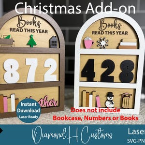 May include: Wooden Christmas add-on with the text "Books READ THIS YEAR". The add-on features a bookshelf design with the numbers 872 and 428. Includes miniature decorative elements like a truck, tree, house, and snowman.