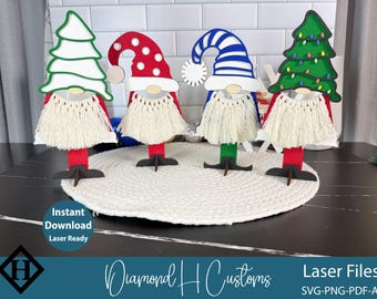 May include: Four wooden gnome decorations with different hat designs: a white Christmas tree, a red polka-dot hat, a blue and white striped hat, and a green Christmas tree with lights. Each gnome has a white beard and a red or green body.