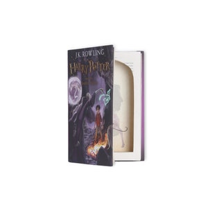 May include: A book cover for "Harry Potter and the Deathly Hallows" by J.K. Rowling. The cover features a dark, illustrated scene with Harry Potter and Voldemort.