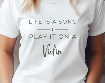 May include: White t-shirt with the text "Life is a song - Play it on a Violin" printed on the front. The text is in black with a musical note symbol above the word "song".