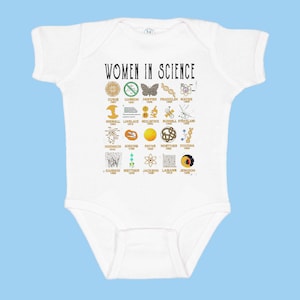 May include: White baby onesie with the text "WOMEN IN SCIENCE" and a grid of icons representing women in science, including their names and years. The icons include a butterfly, a microscope, a DNA strand, and a plant.