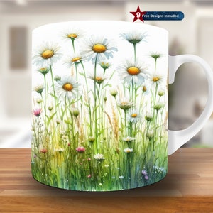 May include: White ceramic mug with a watercolor design of white daisies and green foliage. The mug has a black handle.