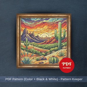 May include: A framed cross-stitch pattern showing a desert scene with cacti, mountains, and a sunset. The artwork uses vibrant colours, including orange, yellow, green, and blue. The frame is a warm brown colour. A red circle with the text "PDF PATTERN" is in the lower right corner.