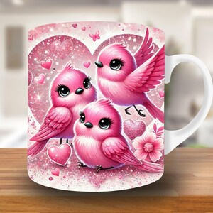 May include: A white ceramic mug with a pink, glittery design featuring three cartoon birds with hearts and sparkles. The birds are pink and have large eyes.