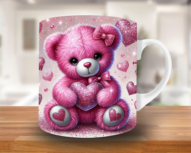 May include: A white ceramic mug with a pink teddy bear holding a pink heart. The mug is decorated with pink glitter hearts.