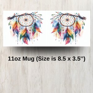 May include: A 11oz white ceramic mug with a colorful dreamcatcher design. The dreamcatcher is made of feathers, beads, and a web-like pattern. The mug is 8.5 inches wide and 3.5 inches tall.
