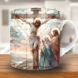 May include: White ceramic mug with a stained glass design depicting Jesus Christ on the cross. The scene includes two figures, one in blue and one in brown, standing below the cross.