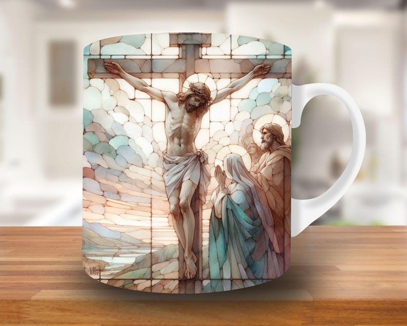 May include: White ceramic mug with a stained glass design depicting Jesus Christ on the cross. The scene includes two figures, one in blue and one in brown, standing below the cross.