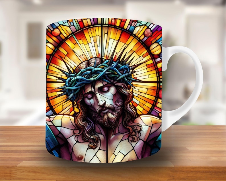 May include: White ceramic mug with a stained glass design featuring a depiction of Jesus Christ with a crown of thorns. The stained glass design is in shades of red, orange, yellow, blue, and purple.
