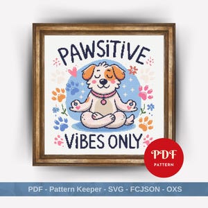 May include: A cross-stitch pattern in a wooden frame featuring a dog sitting in a lotus position with the text PAWSITIVE VIBES ONLY. The design includes colorful paw prints, small flowers, and hearts on a white background with a red PDF PATTERN circle.
