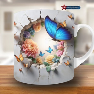 May include: White ceramic mug with a design of a blue butterfly emerging from a cracked wall, surrounded by flowers and other butterflies. The mug has a white handle and the text "9 Free Designs Included".