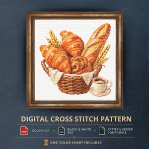 K&ouml;nnte beinhalten: Ein digitales Kreuzstichmuster mit einem geflochtenen Korb voller goldbrauner Croissants, einem Baguette und Weizen&auml;hren, begleitet von einer Tasse Kaffee. Der Text lautet DIGITAL CROSS STITCH PATTERN, COLOR PDF, BLACK & WHITE PDF und DMC COLOR CHART INCLUDED.