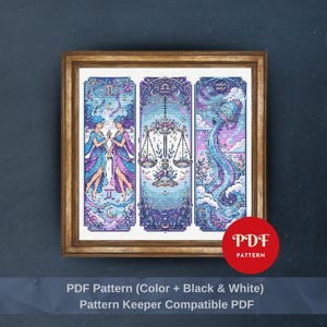 May include: Framed cross-stitch art featuring three panels with zodiac themes. The panels are in shades of blue, purple, and white, with detailed illustrations of Gemini, Libra, and Aquarius. The frame is a warm brown color. The image includes the text "PDF Pattern".