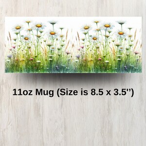 May include: White ceramic mug with a floral design featuring white daisies and other wildflowers in shades of pink, purple, and yellow. The mug is 11 oz and measures 8.5 inches by 3.5 inches.