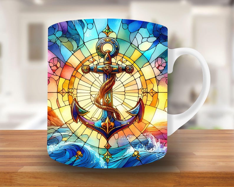 May include: White ceramic mug with a colorful stained glass design featuring an anchor, waves, and a sunset. The anchor is gold and blue with a rope detail.