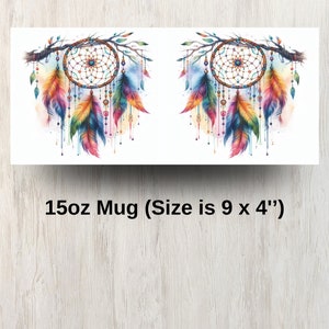 May include: A 15oz white ceramic mug with a colorful dreamcatcher design. The dreamcatcher is surrounded by feathers and beads. The mug is 9 inches wide and 4 inches tall.