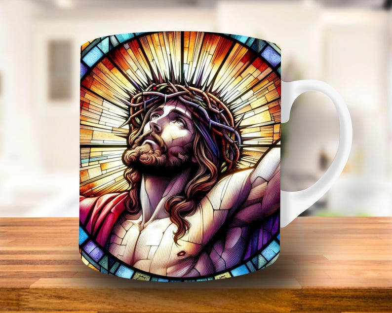May include: White ceramic mug with a colorful stained glass design of Jesus Christ wearing a crown of thorns. The design features a vibrant mix of red, yellow, blue, and purple.
