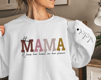 Custom This Mama Wears Her Heart On Her Sleeve Sweatshirt, Personalized Mom Sweater With Kids Names, Mothers Day Gifts, Cute Momma Outfit