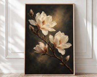May include: A rectangular wall art print in a light wood frame featuring a painting of three white magnolia blossoms and several closed buds on a dark, moody background with a soft golden light glow behind the flowers.