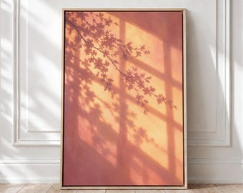 May include: A rectangular framed wall art piece featuring a warm, gradient background in shades of orange and pink. The image displays a dark, silhouetted shadow of a flowering tree branch cast across the surface, overlaid with a grid-like window frame shadow.