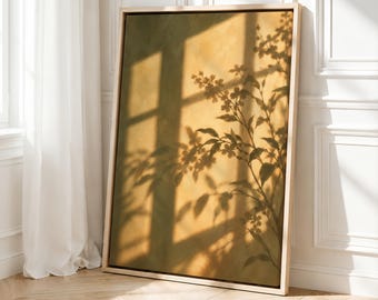 May include: A rectangular framed wall art piece featuring a gradient of olive green and golden yellow tones. The artwork displays a dark, intricate shadow of a leafy plant branch cast across the surface, creating a layered visual effect.