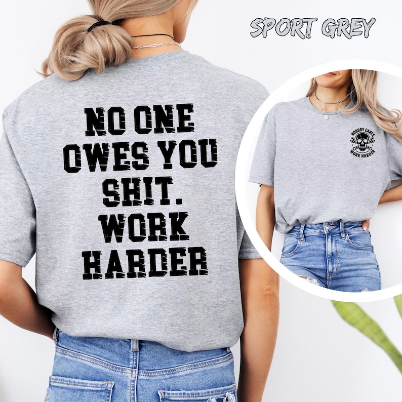 May include: Sport grey t-shirt with the text "NO ONE OWES YOU SHIT. WORK HARDER" in black block letters on the back. The front of the shirt has a small skull graphic with the words "NOBODY CARES WORK HARDER".