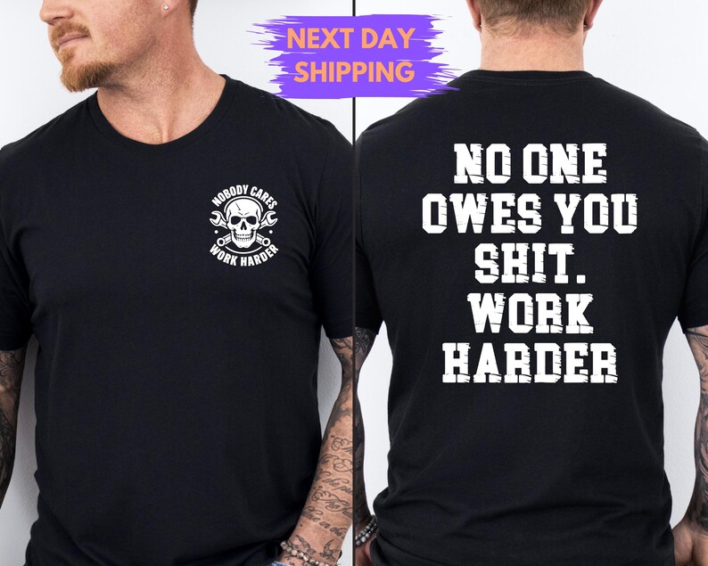 May include: Black crew neck t-shirt with white text and graphics. The front features a skull with tools and the words "NOBODY CARES WORK HARDER". The back says "NO ONE OWES YOU SHIT. WORK HARDER".