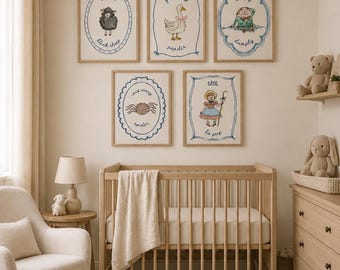 May include: A nursery room with five framed illustrations featuring nursery rhyme characters. The illustrations are in wooden frames with blue and white accents. A wooden crib, rocking chair, and dresser are also in the room. A sheepskin rug is on the floor.